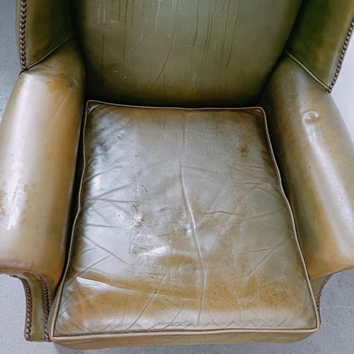 159 - A George III style wingback armchair