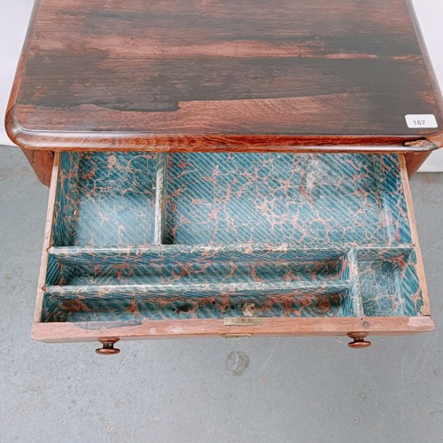 167 - A 19th century rosewood work table, with a single drawer above a silk rag box, on twin end supports ... 