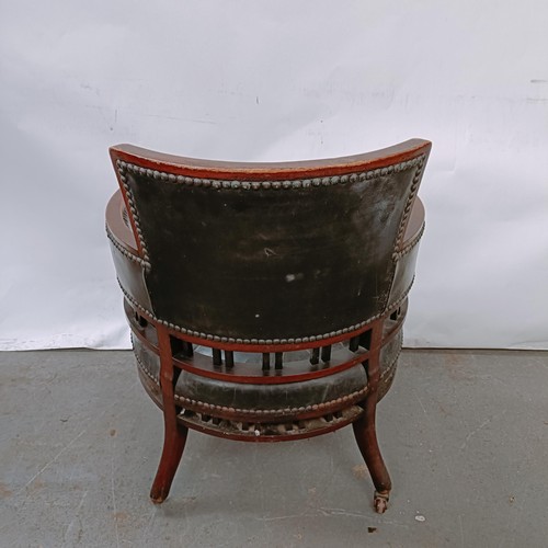 169 - A late Victorian mahogany and leather tub chair