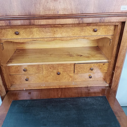 174 - A 19th century French escritoire, with a drawer above a fall front to reveal a fitted satinwood inte... 