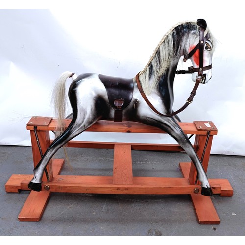 177 - A 20th century fibreglass rocking horse