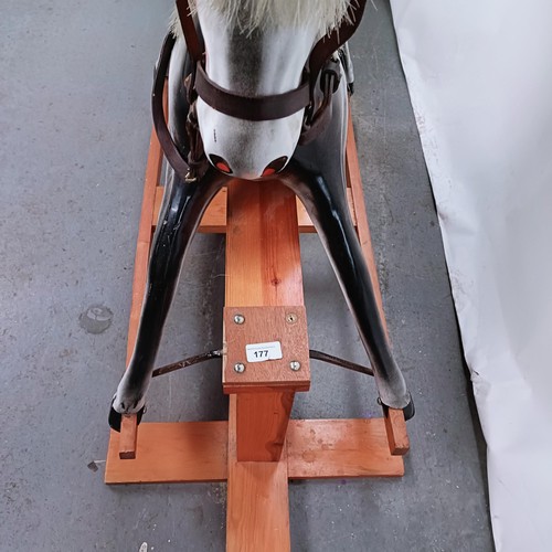 177 - A 20th century fibreglass rocking horse