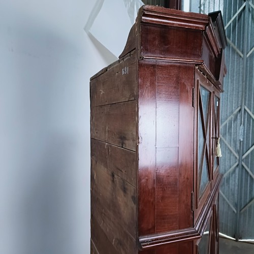 180 - A Victorian mahogany corner cabinet, the top with two glazed doors, the base with two glazed doors, ... 