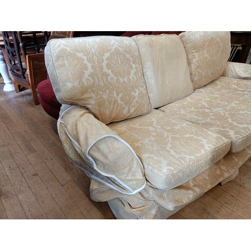 1003 - A three seater sofa, 205 cm wide