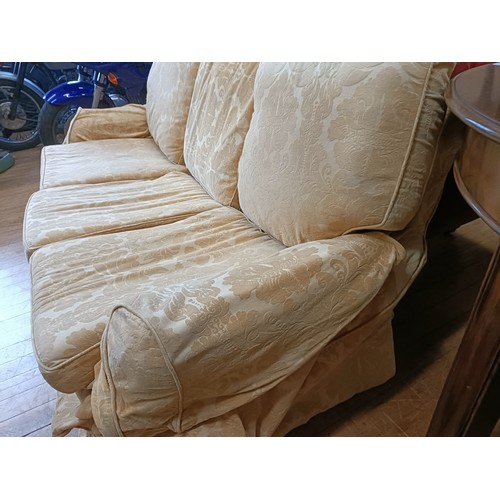 1003 - A three seater sofa, 205 cm wide