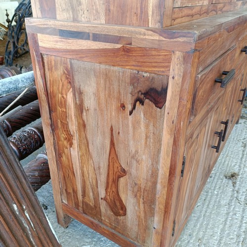 1 - A hardwood display cabinet, with three glazed doors, on a base with three drawers and three cupboard... 