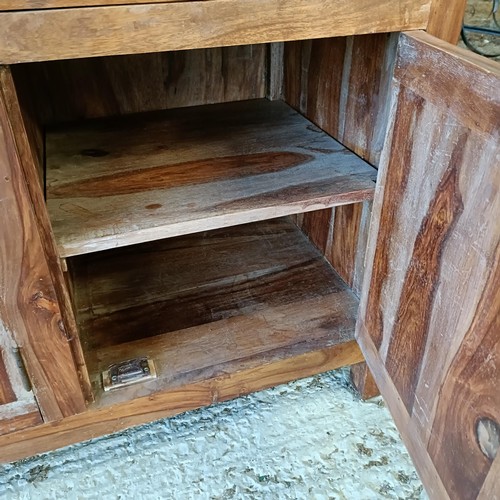 1 - A hardwood display cabinet, with three glazed doors, on a base with three drawers and three cupboard...