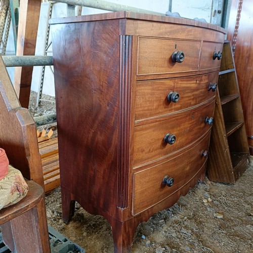 3 - A mahogany bow front chest, of two short and three long drawers, 105 cm wide<br /><br />Please note ...