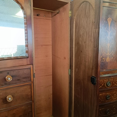 5 - A 19th century mahogany compactum, with two central mirrored doors, above two short and three long d...