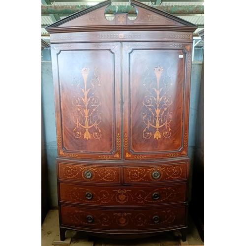 6 - A late 19th century Sheraton Revival inlaid mahogany bow front linen press, two cupboard doors to re... 