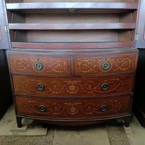 6 - A late 19th century Sheraton Revival inlaid mahogany bow front linen press, two cupboard doors to re... 