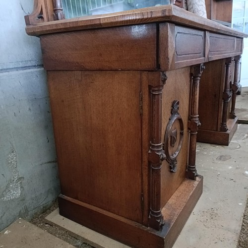 9 - A 19th century oak sideboard, with a raised mirrored back, 216 cm wide<br /><br />Please note collec...