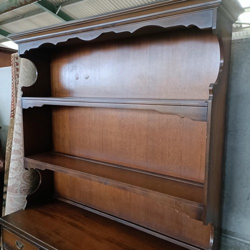 10 - A mahogany sideboard, 140 cm wide and a machine made carpet (2)<br /><br />Please note collection is...