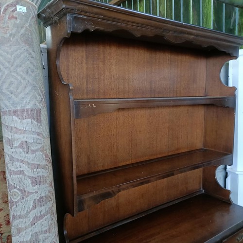 10 - A mahogany sideboard, 140 cm wide and a machine made carpet (2)<br /><br />Please note collection is...