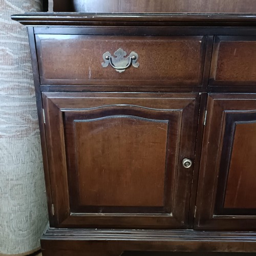 10 - A mahogany sideboard, 140 cm wide and a machine made carpet (2)<br /><br />Please note collection is...