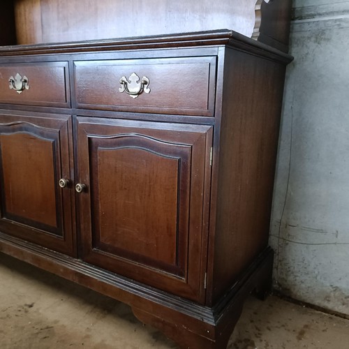 10 - A mahogany sideboard, 140 cm wide and a machine made carpet (2)<br /><br />Please note collection is...