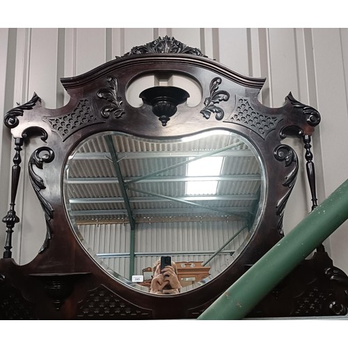 245 - A walnut framed overmantle mirror, 110 x 130 cmPlease note collection is from TA9 4LJ only on 22nd, ... 