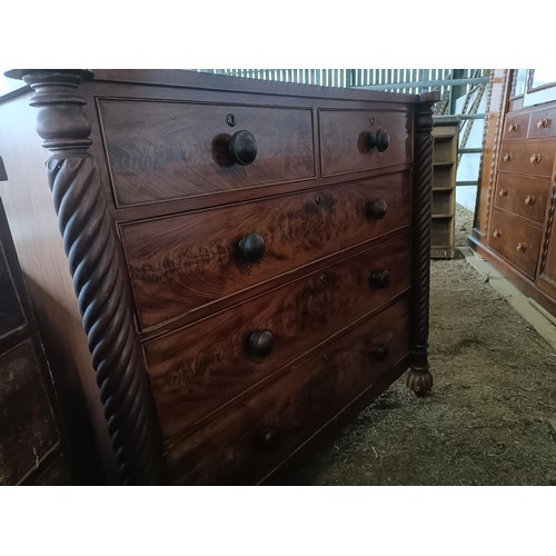 18 - A mahogany chest, with two short and three long drawers spiral turned supports, 136 cm wide<br /><br...