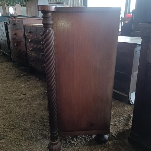 18 - A mahogany chest, with two short and three long drawers spiral turned supports, 136 cm wide<br /><br...