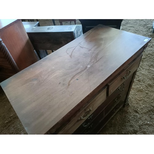 19 - A mahogany chest, with two short and three long drawers, 130 cm wide<br /><br />Please note collecti...