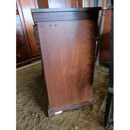 19 - A mahogany chest, with two short and three long drawers, 130 cm wide<br /><br />Please note collecti...