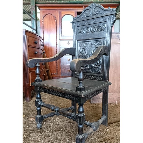 20 - An oak wainscot type chair, with a carved backPlease note collection is from TA9 4LJ only on 22nd, 2... 