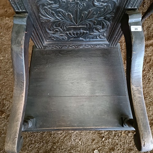 20 - An oak wainscot type chair, with a carved back<br /><br />Please note collection is from TA9 4LJ onl...