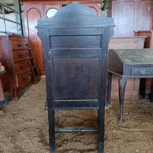 20 - An oak wainscot type chair, with a carved back<br /><br />Please note collection is from TA9 4LJ onl...