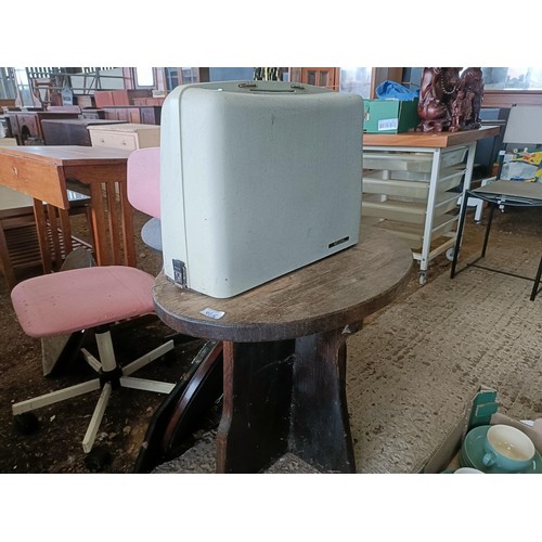 41 - An oak school desk, 80 cm wide, four mirrors, two office chairs, an oval oak table, and a sewing mac...