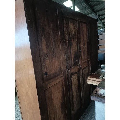 43 - A Victorian mahogany triple wardrobe, with a central mirrored door, 220 cm wide<br /><br />Please no...