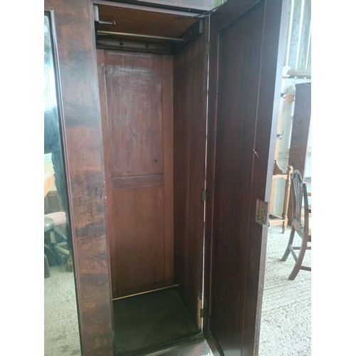 43 - A Victorian mahogany triple wardrobe, with a central mirrored door, 220 cm wide<br /><br />Please no...