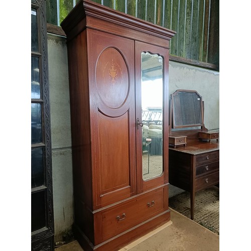 42 - An early 20th century wardrobe, 102 cm wide, and a dressing chest, 106 cm wide<br /><br />Please not...