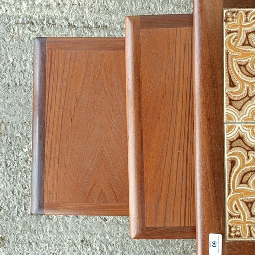 50 - A 20th century nest of teak tile top coffee tables, 15 cm wide (3)<br /><br />Please note collection...