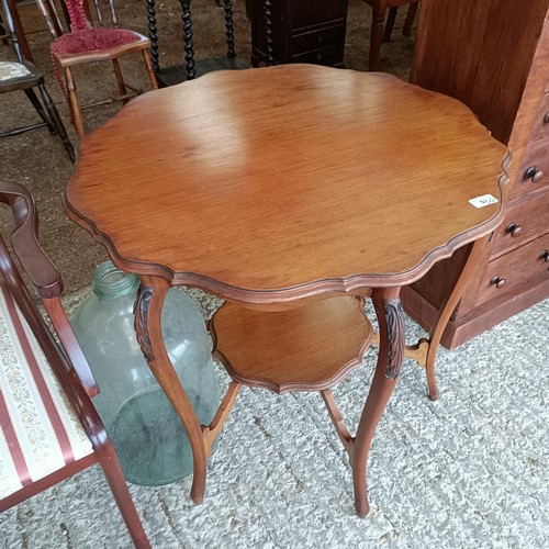 52 - A walnut lamp table, 83 cm wide, a glass bottle, a nursing chair, and an armchair<br /><br />Please ...