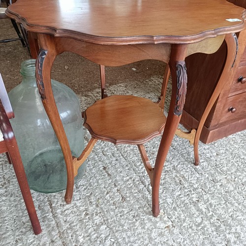 52 - A walnut lamp table, 83 cm wide, a glass bottle, a nursing chair, and an armchair<br /><br />Please ...