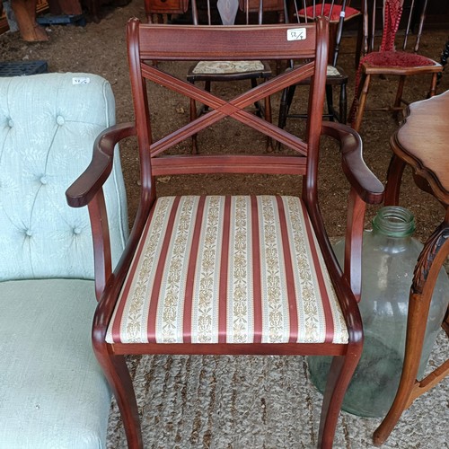 52 - A walnut lamp table, 83 cm wide, a glass bottle, a nursing chair, and an armchair<br /><br />Please ...