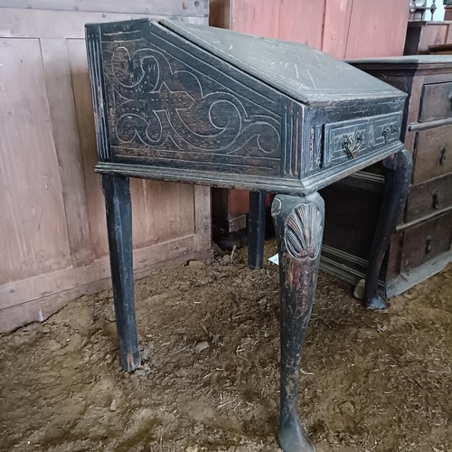 21 - A carved oak bureau, on cabriole legs, 80 cm high<br /><br />Please note collection is from TA9 4LJ ...