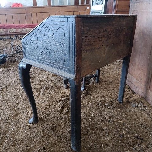 21 - A carved oak bureau, on cabriole legs, 80 cm high<br /><br />Please note collection is from TA9 4LJ ...