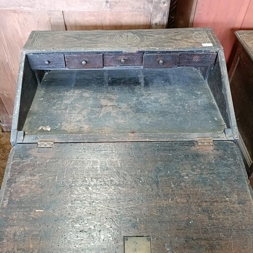 21 - A carved oak bureau, on cabriole legs, 80 cm high<br /><br />Please note collection is from TA9 4LJ ...