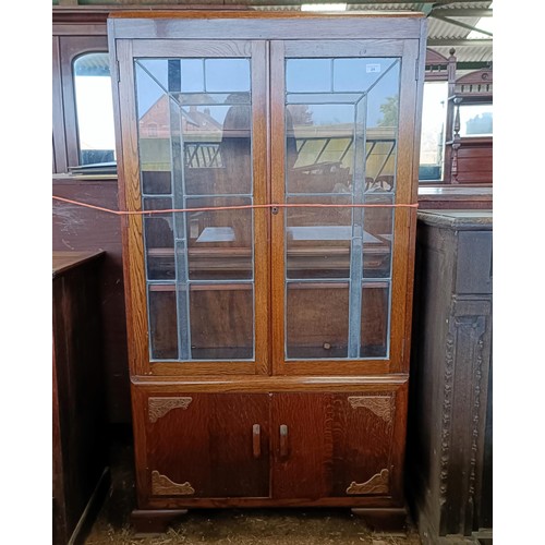 24 - An Art Deco oak display cabinet, 85 cm widePlease note collection is from TA9 4LJ only on 22nd, 23rd... 