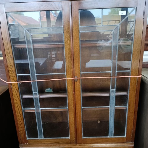 24 - An Art Deco oak display cabinet, 85 cm wide<br /><br />Please note collection is from TA9 4LJ only o...