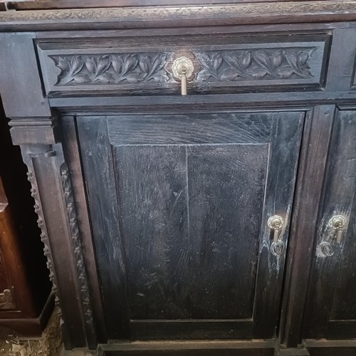 25 - An oak sideboard, 132 cm wide<br /><br />Please note collection is from TA9 4LJ only on 22nd, 23rd, ...