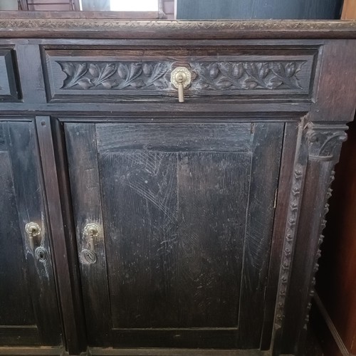 25 - An oak sideboard, 132 cm wide<br /><br />Please note collection is from TA9 4LJ only on 22nd, 23rd, ...