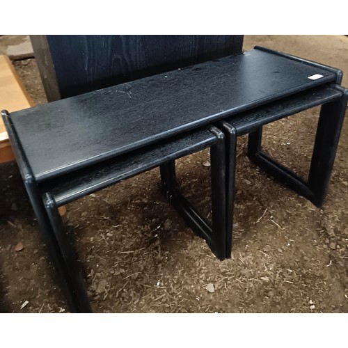 27 - An oak school desk and stool, with a metal frame, a modern coffee table, and a nest of three tables<...