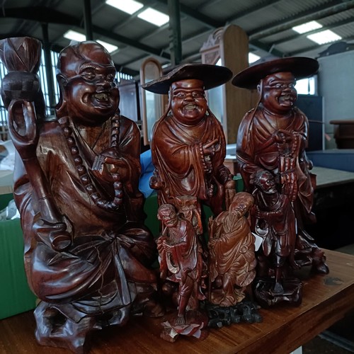 31 - A Chinese carved wooden figure, 38 cm high, its pair, and four others (6)Please note collection is f... 