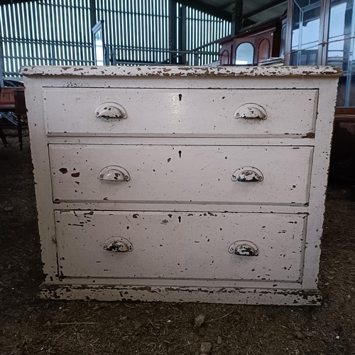 33 - A painted pine chest, with three long drawers, 86 cm wide, and an armchair<br /><br />Please note co...