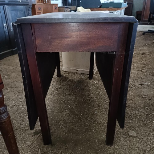 34 - A mahogany drop leaf table, 110 cm wide<br /><br />Please note collection is from TA9 4LJ only on 22...