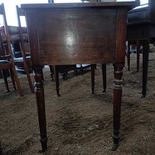 35 - A mahogany kneehole dressing table, with three drawers, 105 cm wide<br /><br />Please note collectio...