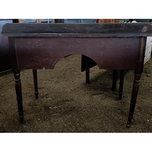 35 - A mahogany kneehole dressing table, with three drawers, 105 cm wide<br /><br />Please note collectio...