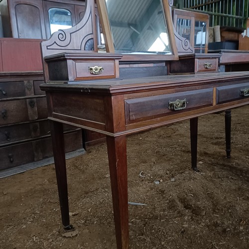 36 - An early 20th century mahogany dressing table, with two frieze drawers, 109 cm wide<br /><br />Pleas...